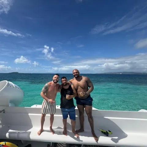 The catamaran deck above clear water at Icacos