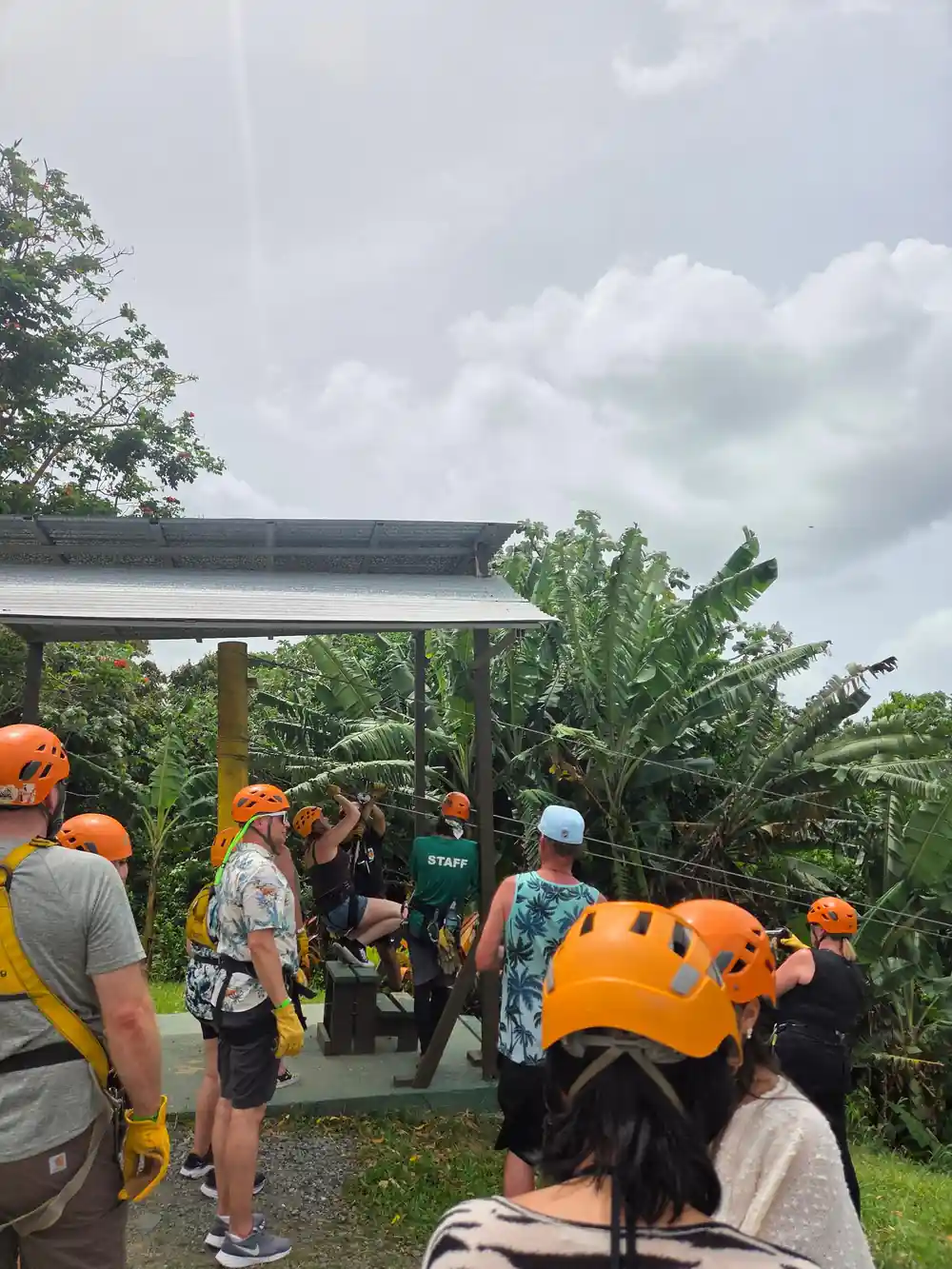 A group being fitted with harnesses and helmets