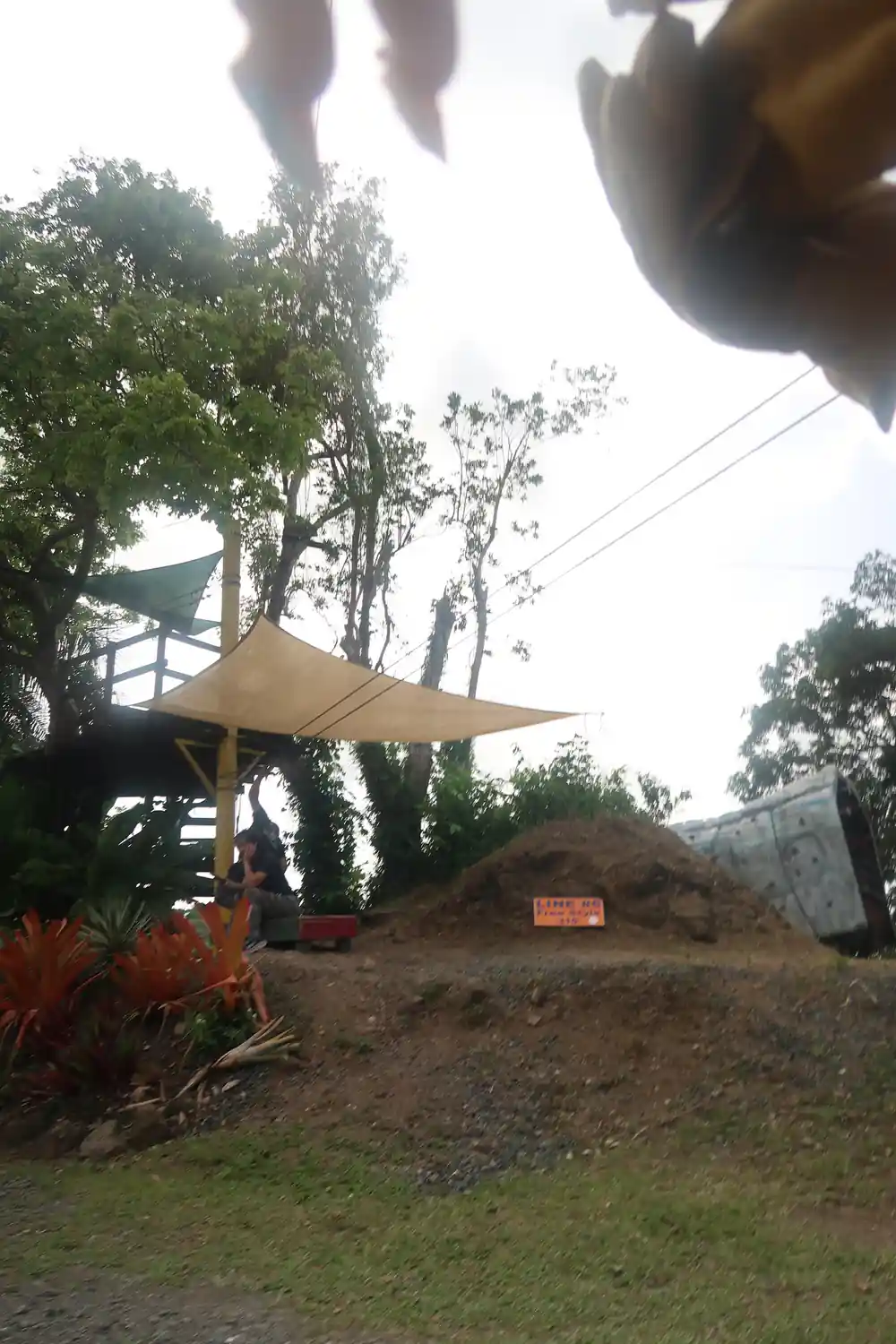 Shade sails over the yard at the base